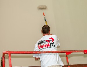 Here a Paint It OKC house painter is using a paint roller on an interior painting project in Oklahoma City.
