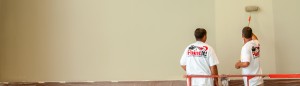 Paint It OKC house painters working on a commercial painting job.