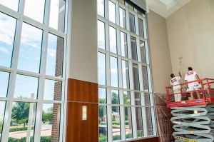 A couple of Paint It OKC painters working on a commercial painting project at the University of Central Oklahoma.