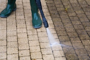 Paint It OKC is power washing a deck to make it look new again.