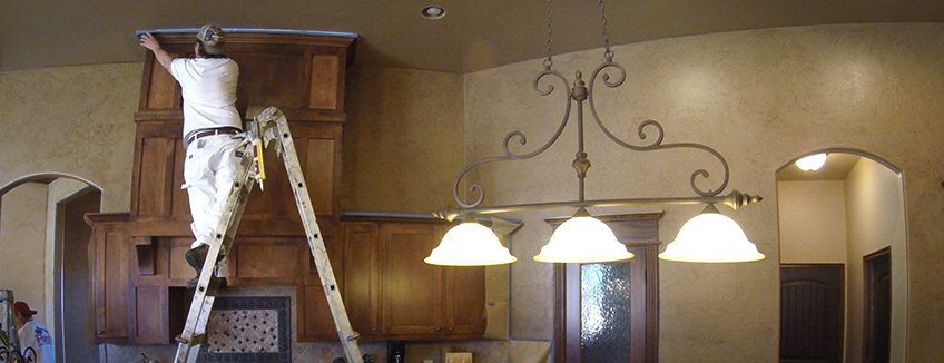 A Paint It OKC Painter is adding the finishing touches to an interior painting job in north Oklahoma City.