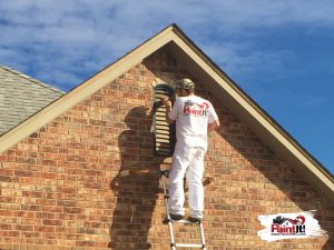 an oklahoma city painter painting the outside of a home