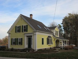 victorian style home painted in yellow
