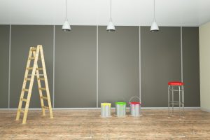 living room wall with paint cans