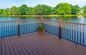 a newly painted deck overlooking a lake